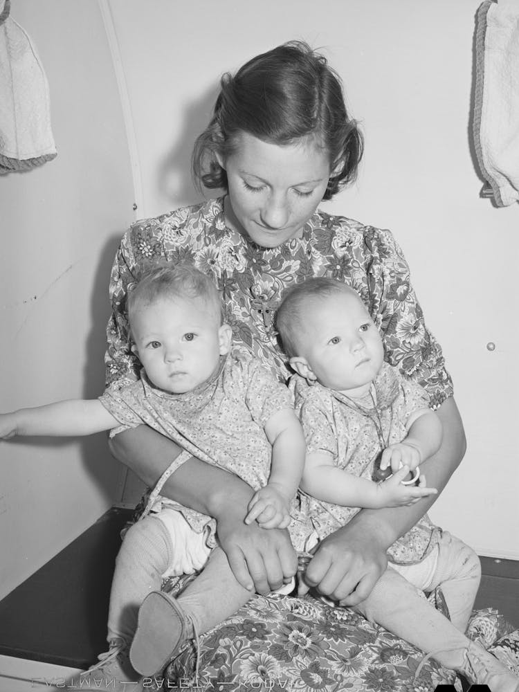 Mother And Her Twin Babies In The Trailer Clinic At The Fsa (Farm Security Administration) Migratory Labor Camp