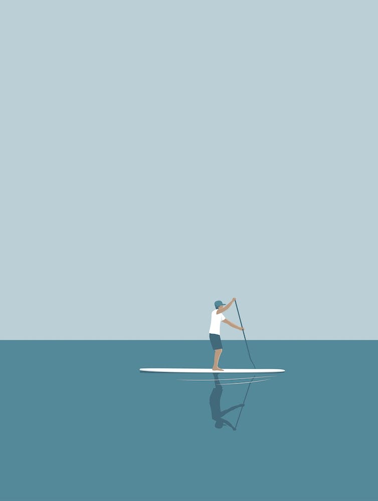 Paddle boarder in the ocean