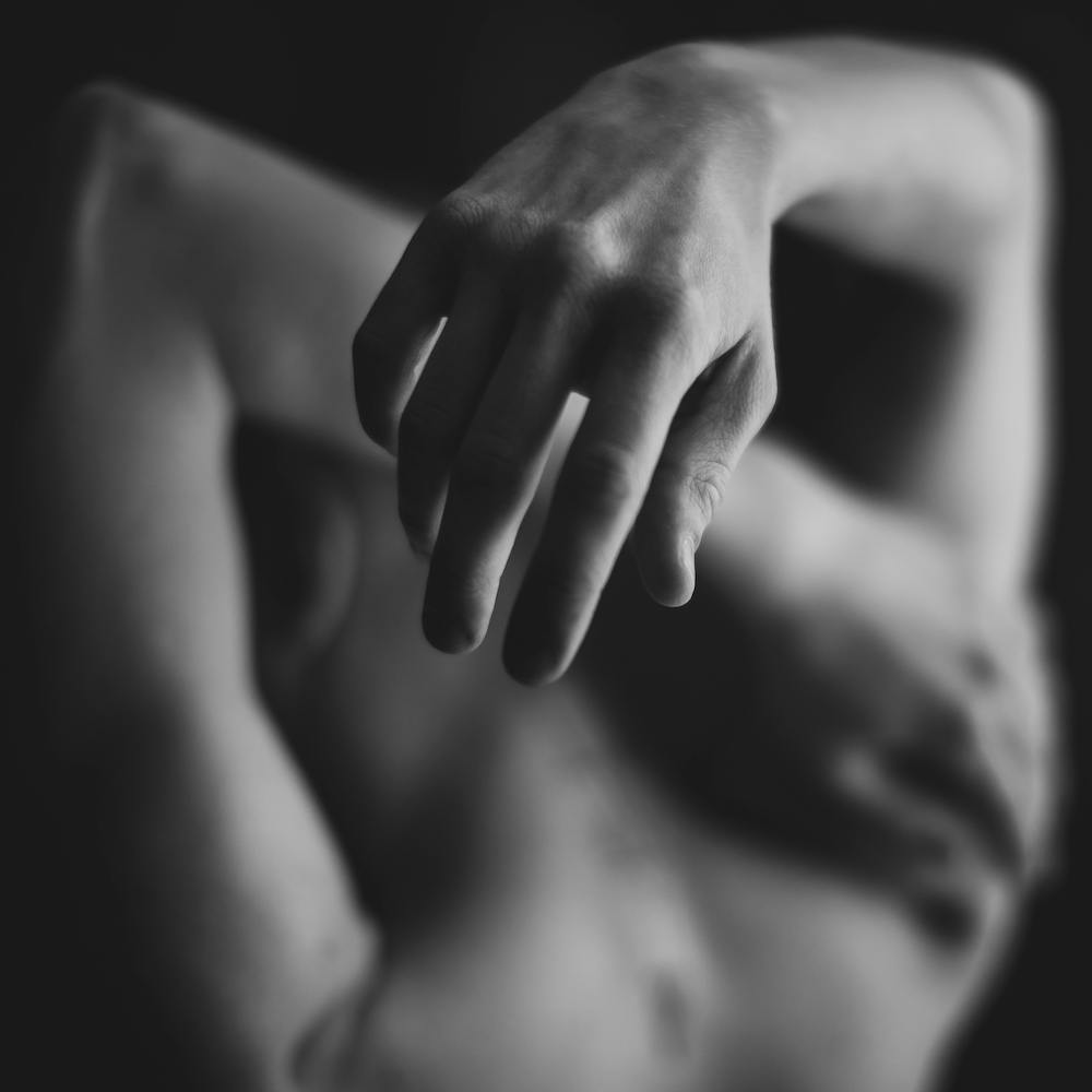 A farmer cares for his field in the mist