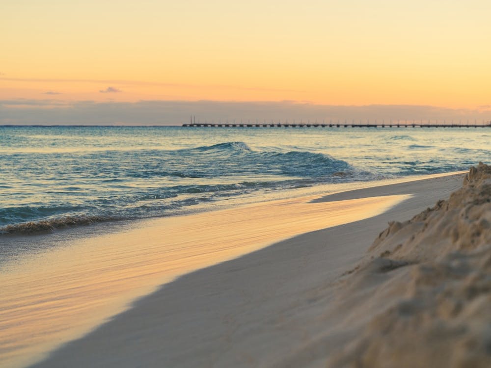 Ocean Waves Sunset On The Beach