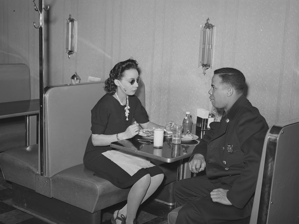 Policeman Talking To Employee Of Ten Cent Store Whose Trade Is Predominantly ,Chicago, Illinois By Russell Lee