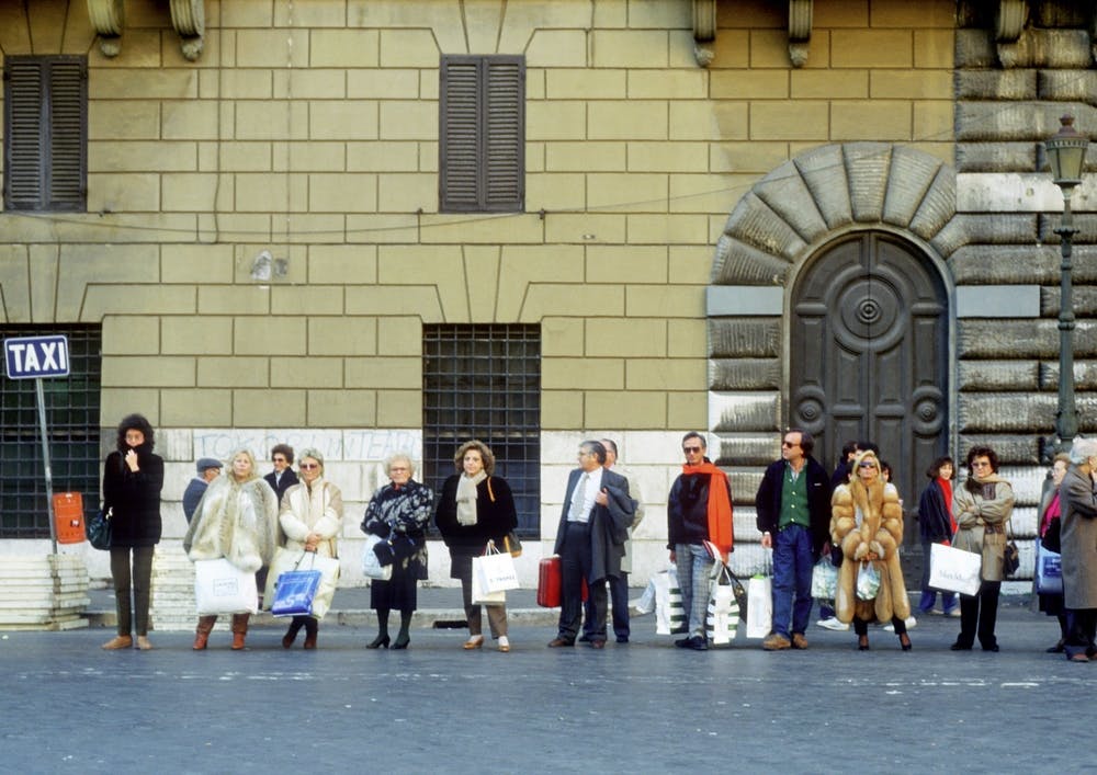 Taxi Queue Of Shoppers Rome Italy Yellow & Blue