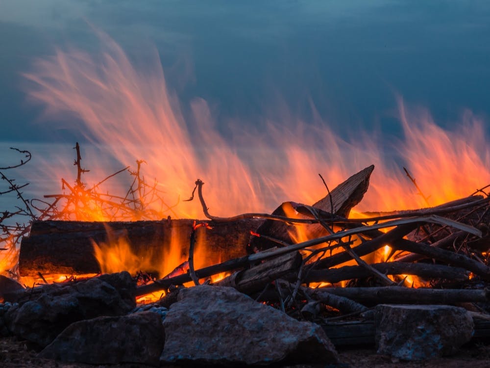 Campfire At Twilight On Beach