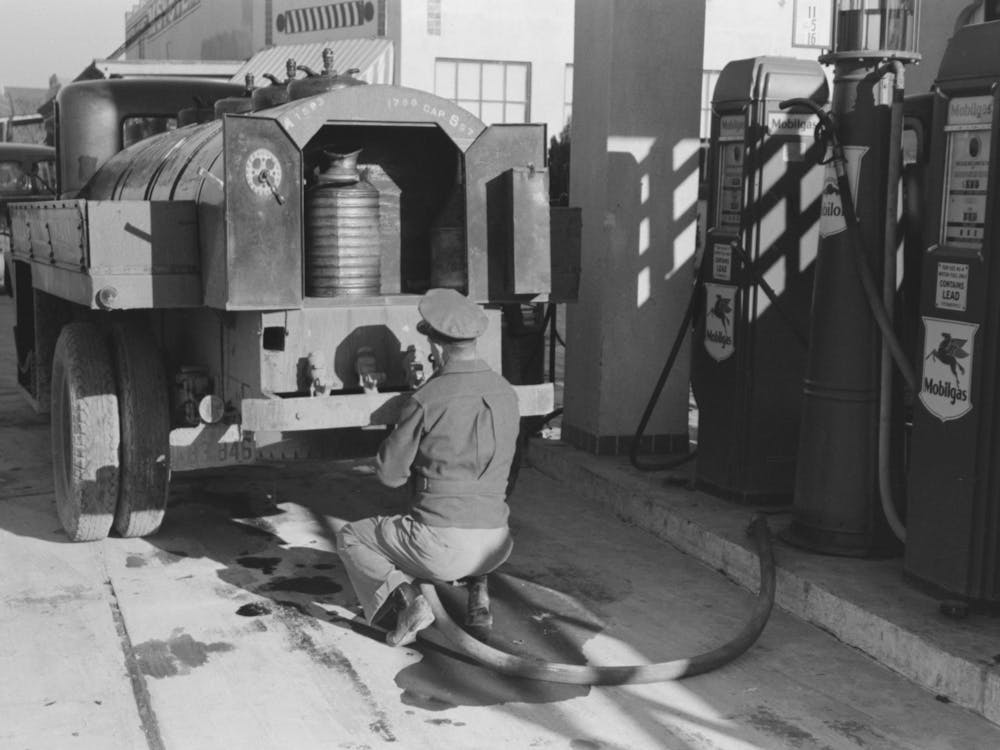 Gasoline Truck Driver Getting Ready To Fill Service Stations Tank With Gasoline, San Angelo, Texas By Russell Lee