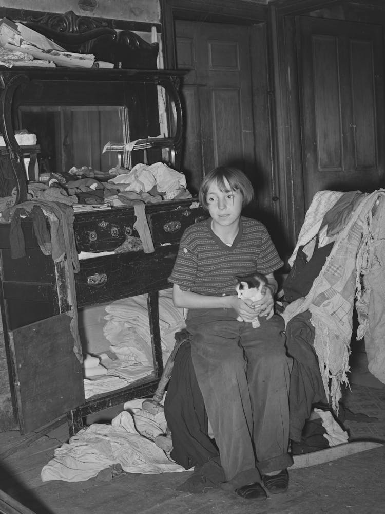 Daughter Of Fsa (Farm Security Administration) Client Sitting In Front Of Dining Room Sideboard Saved From