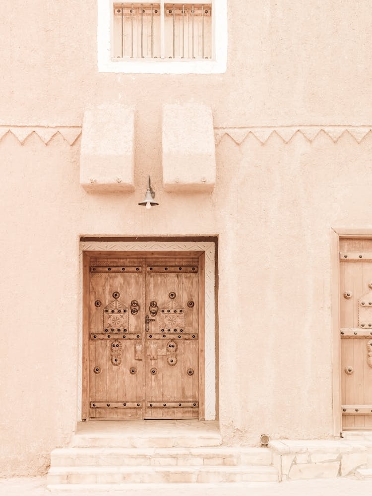 Peach Coloured Wall With A Door