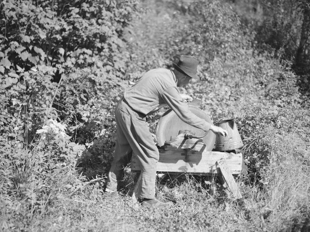 William Besson, Old Iron Ore Prospector, Grinding An Axe Near Winton, Minnesota By Russell Lee