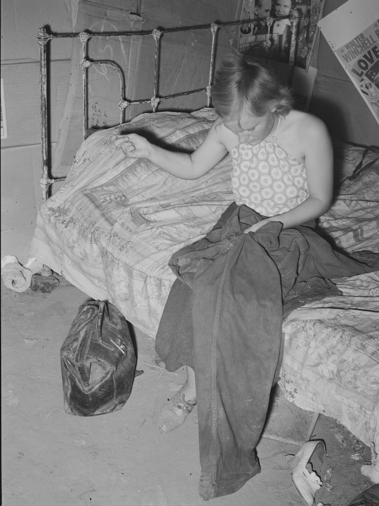 Young Married Girl Living In Mays Avenue Camp Patching Her Husband S Overalls, Oklahoma City, Oklahoma By Russell
