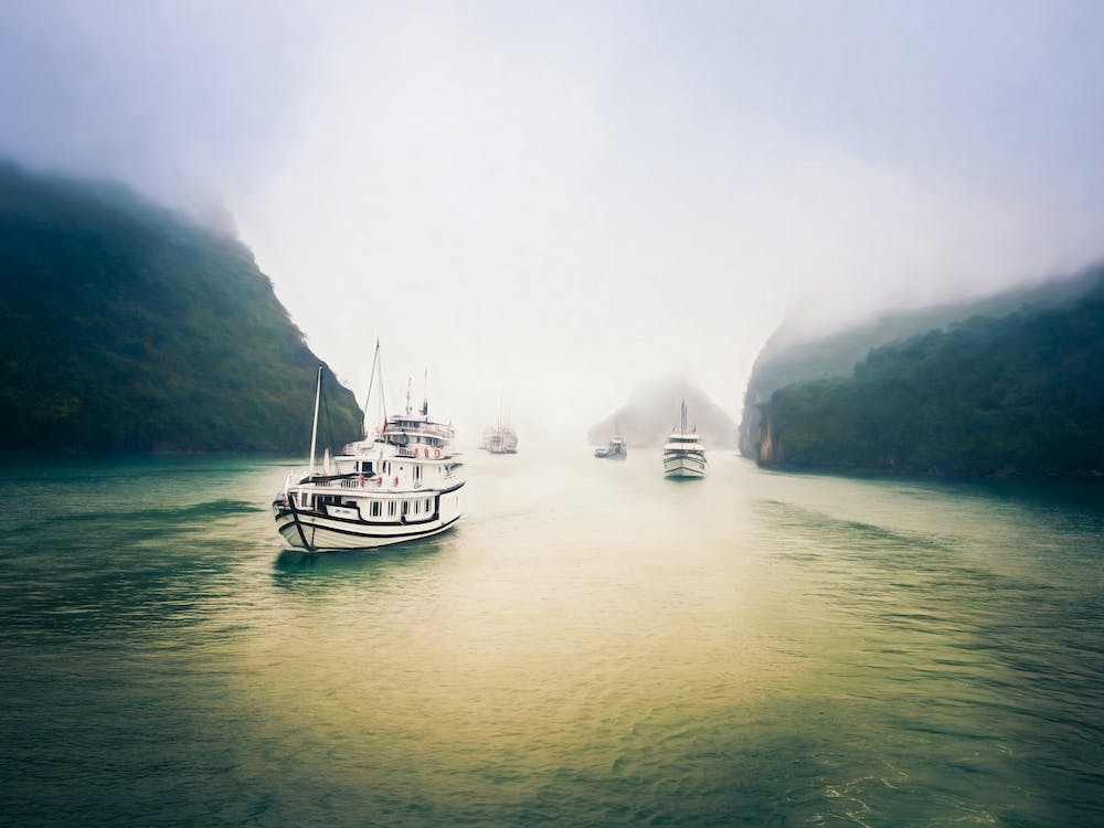 Leaving A Misty Halong Bay