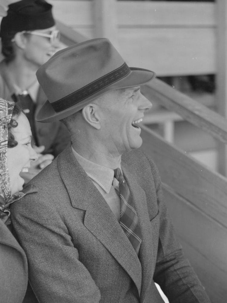 Untitled Photo, Possibly Related To Spectator Laughing At The Antics Of A Cowboy Clown At The Rodeo Of The San