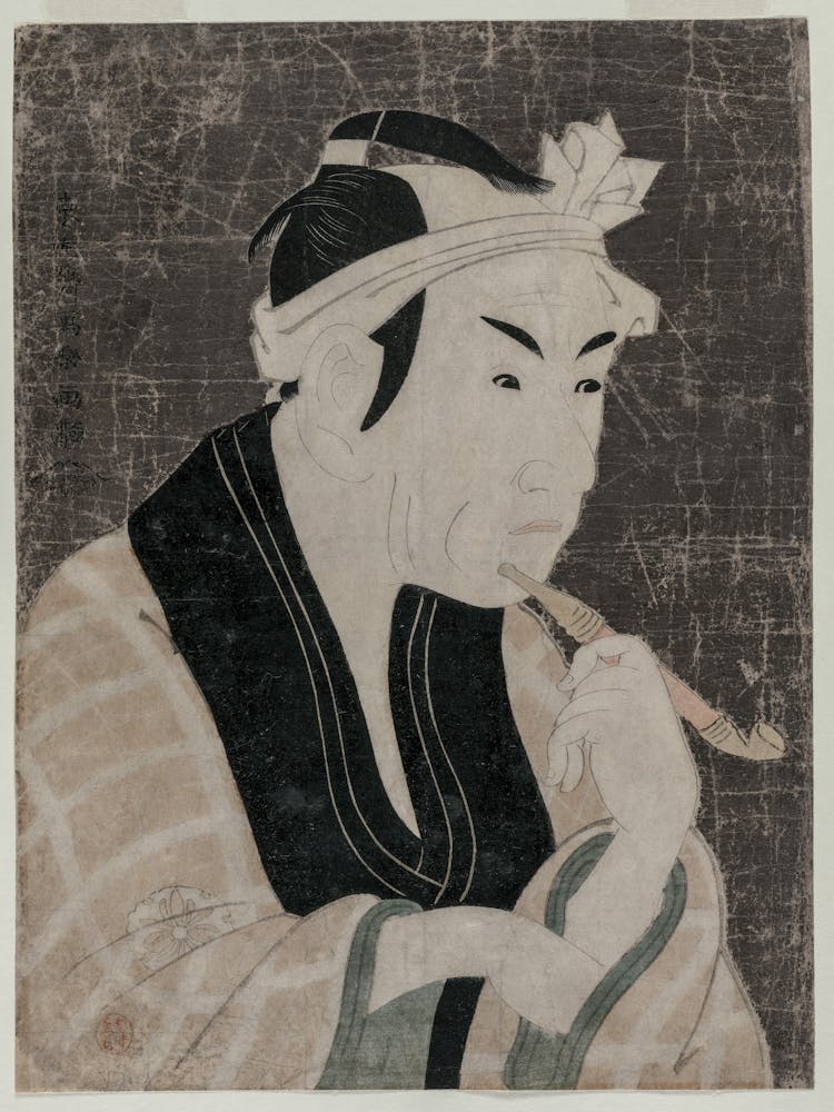 Man Smoking A Pipe