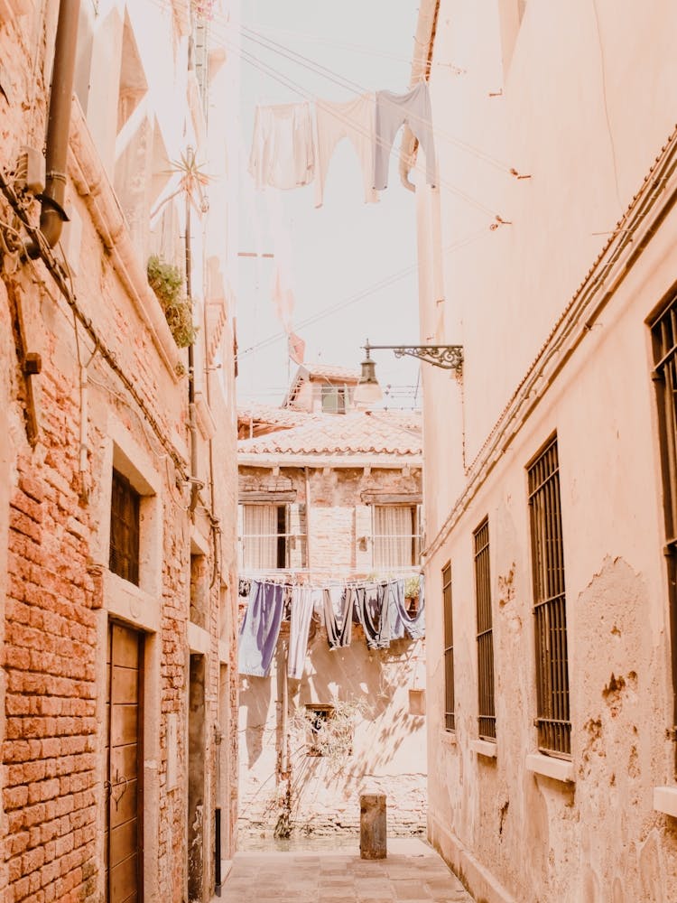 Blush Laundry Alleyway In Venice, Italy