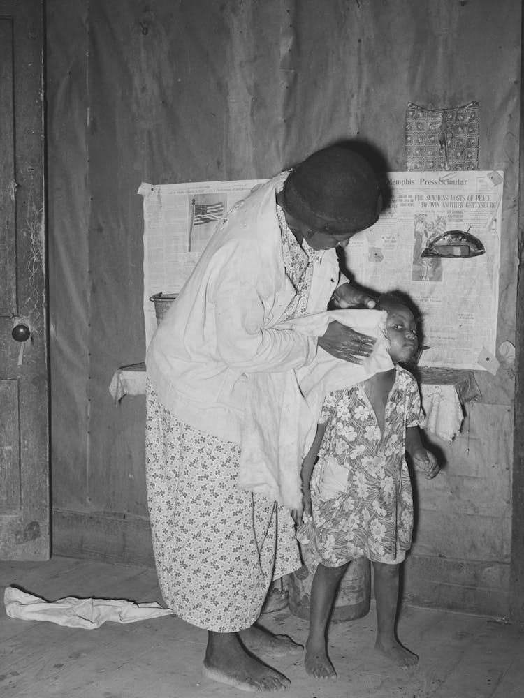 Wife Of Sharecropper Washing Daughter S Face, Family Will Participate In Tenant Purchase Program