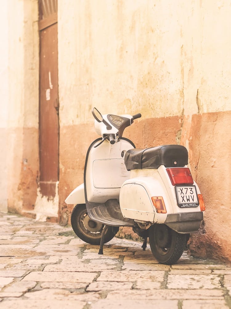 Puglia, Italy I Photography of a vintage scooter on a picturesque retro vintage Bari street Mediterranean capturing the essence of Italian streets with the authentic spirit of Italy