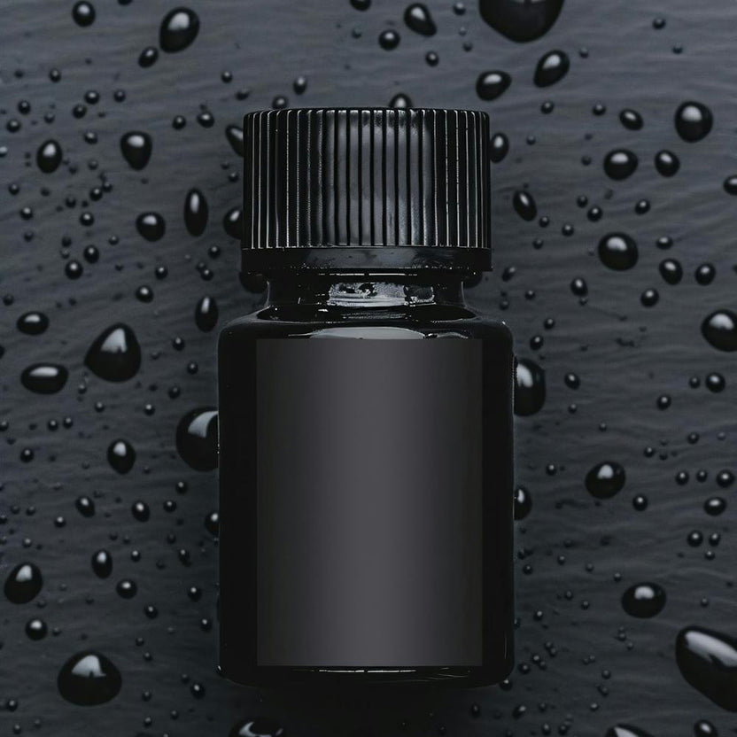 Black Bottle With Drops Of Water