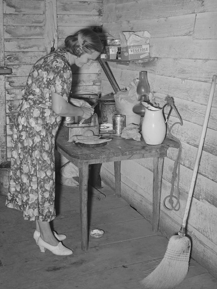 Mrs Adams, Wife Of Farmer Near Morganza, Louisiana, Preparing Sweet Potatoes For Dinner, Family Will Shortly