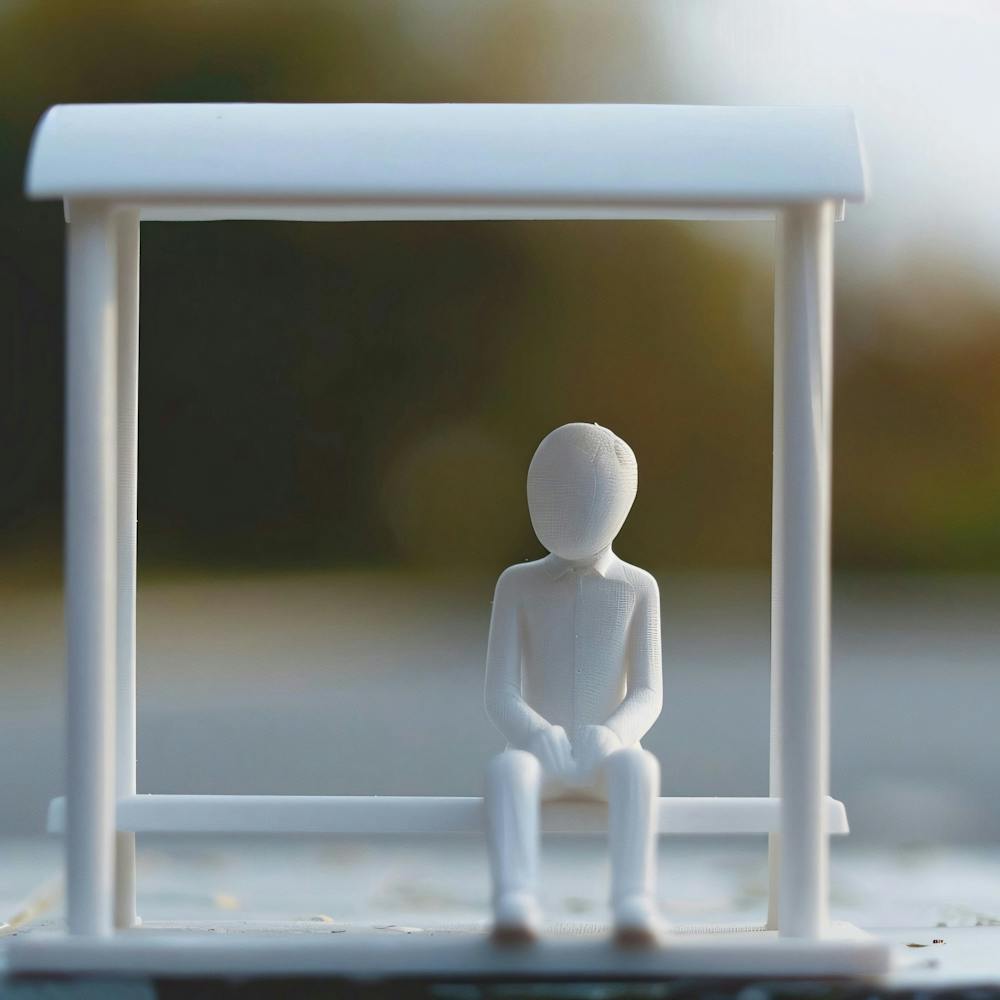 Man Sitting On Bench