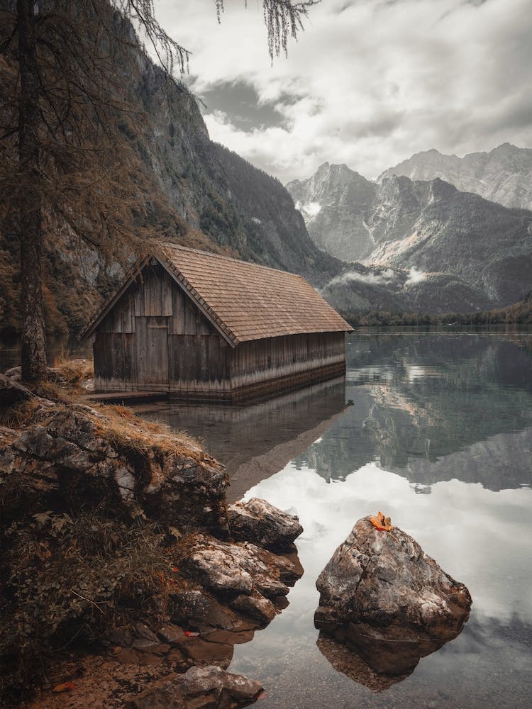 Moody Boat House On Lake