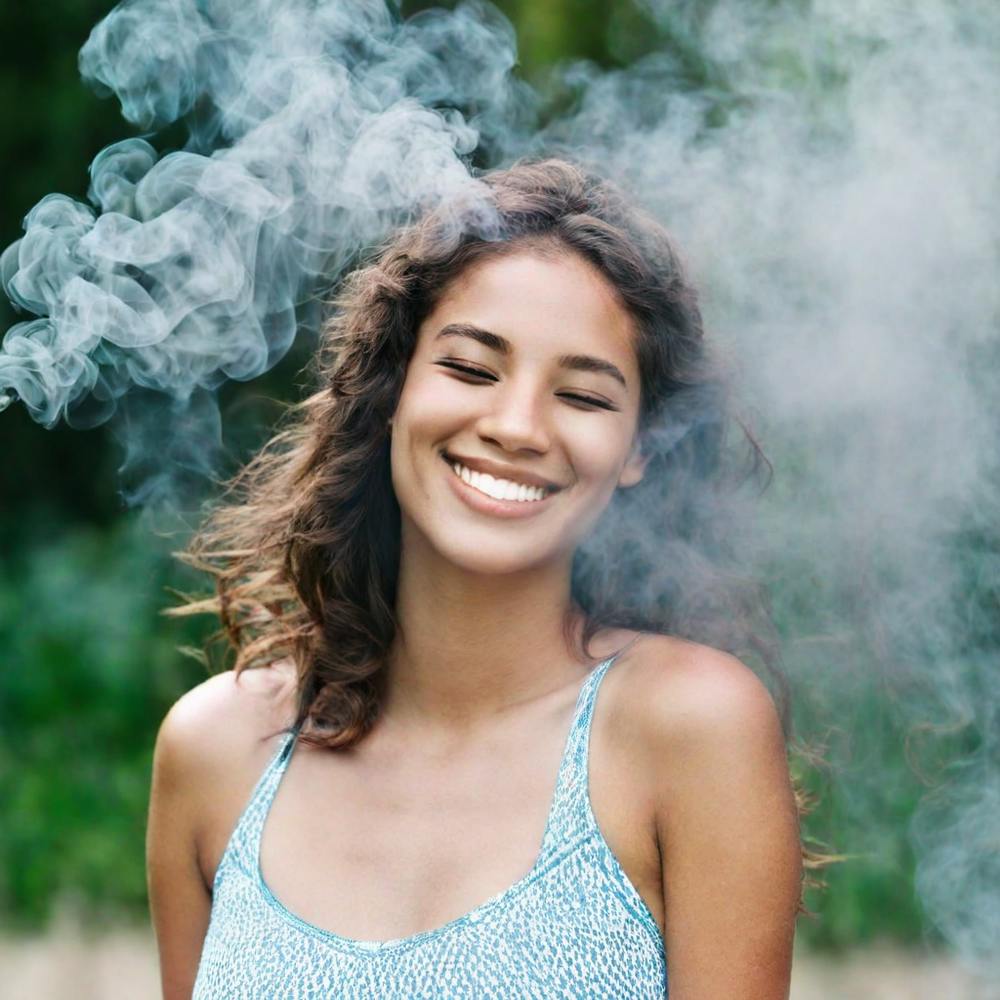 Smiling Woman With Smoke