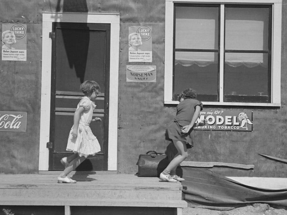 Children Playing In Front Of Saloon, Gemmel, Minnesota By Russell Lee