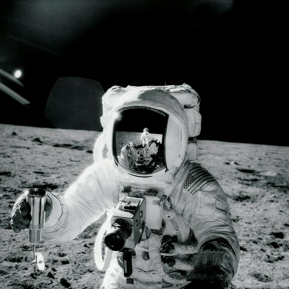 Astronaut Alan Bean Holds Special Environmental Sample Container
