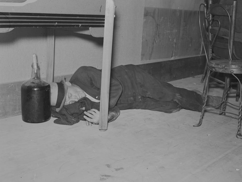 Lumberjack Under The Table In A Saloon,Craigville, Minnesota By Russell Lee