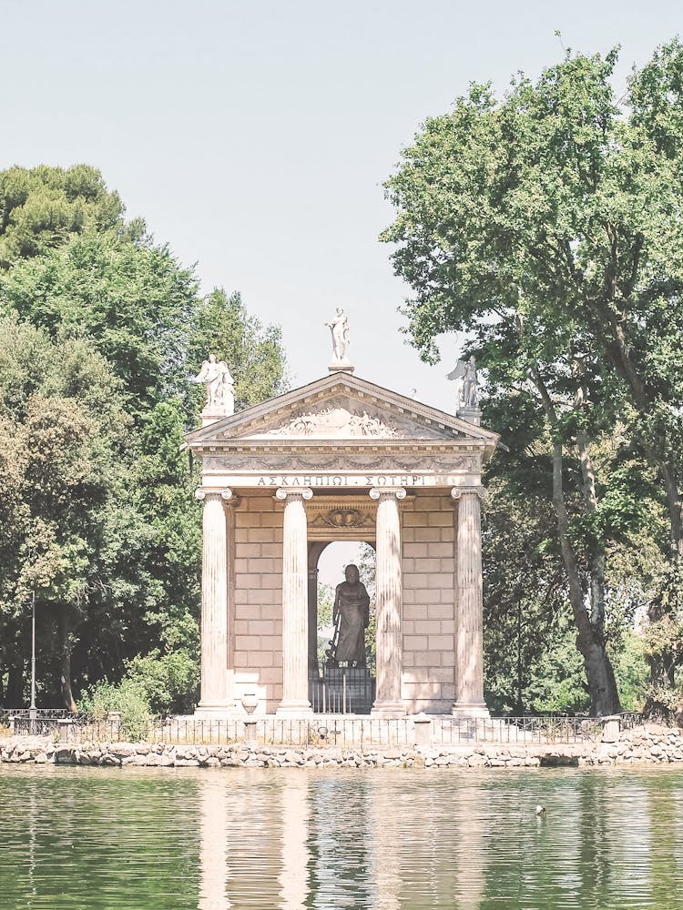 Rome, Italy I Temple of Asclepius by a serene lake in Villa Borghese gardens with summer nature romantic reflections, pastel aesthetic vintage charm photography to live Mediterranean la dolce vita