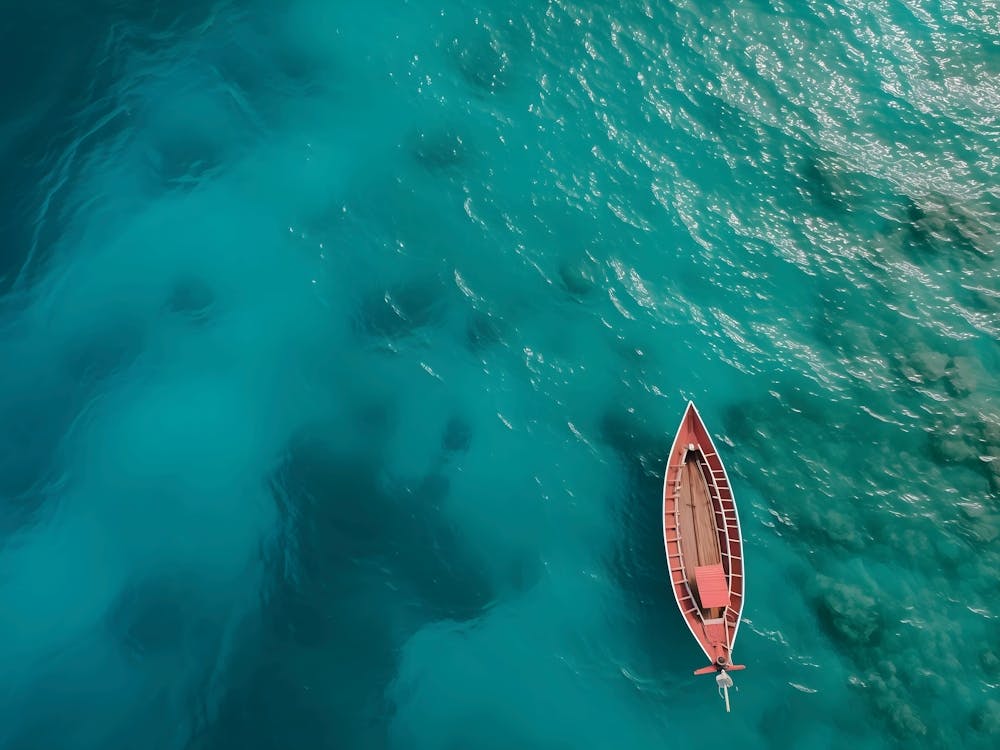 Small Boat In Blue Sea