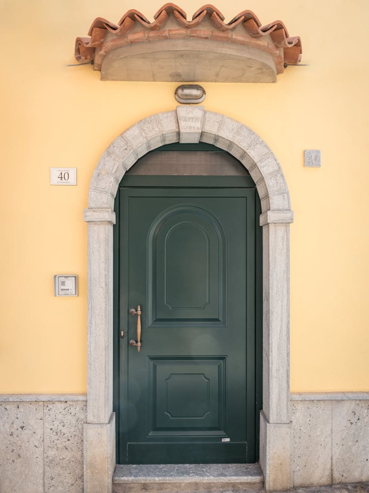 Green Door With Yellow Wall in Italy