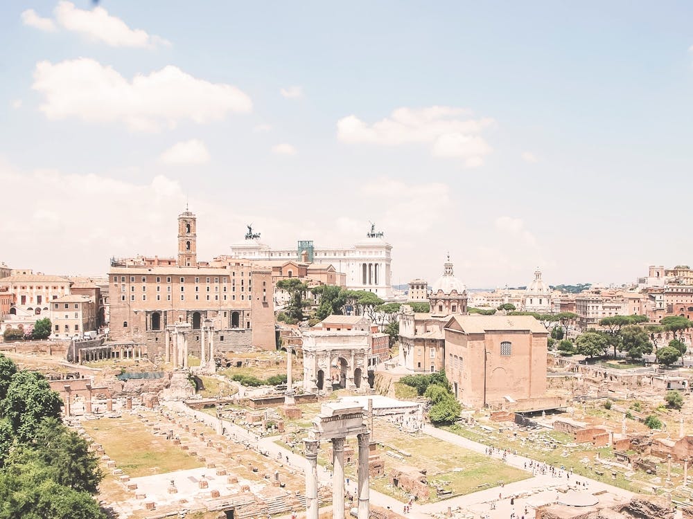 Rome, Italy I Panoramic view of the Roman Forum and its ancient ruins bathed in summer pastel light capturing the essence of la dolce vita with old retro vintage italian architecture photography