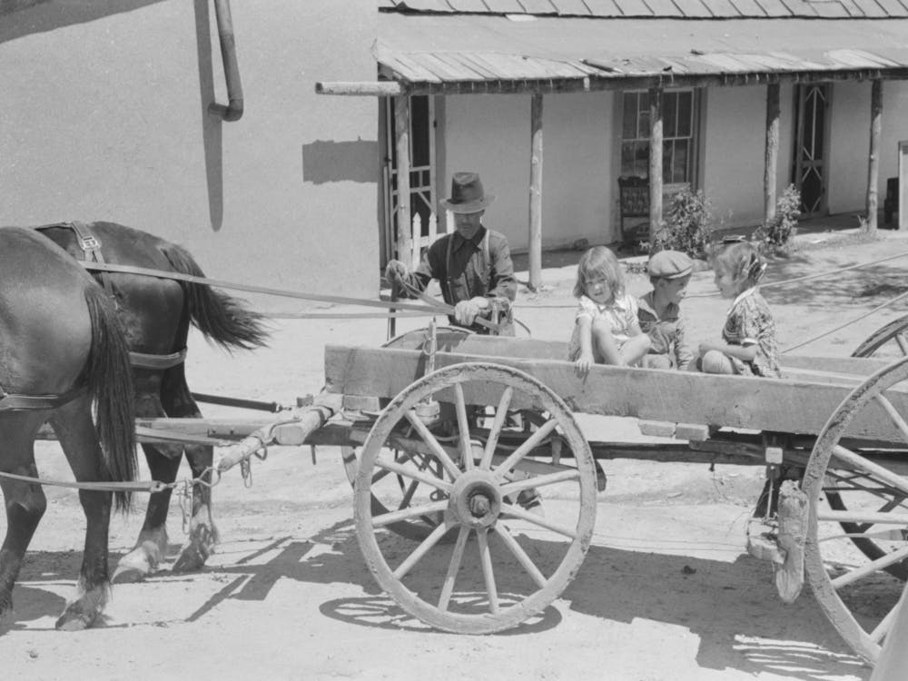 Spanish American Farmer And Family Arriving At Penasco, New Mexico For Shopping By Russell Lee