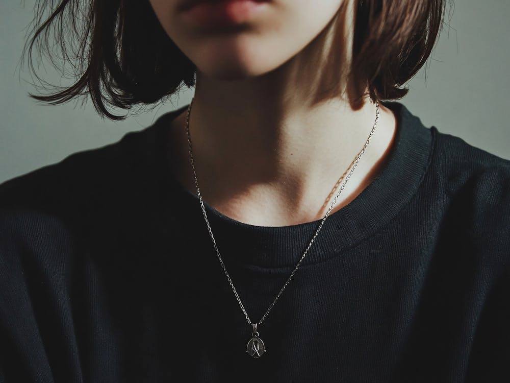 Portrait Of A Woman Wearing A Necklace