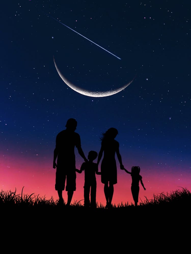 Familiensilhouette bei Nacht