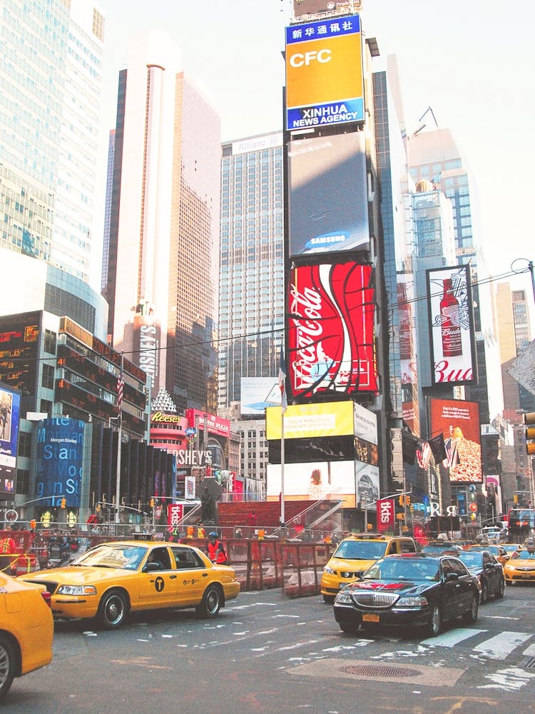 New York, USA I Times Square madness with taxis yellow cabs and its ads to illustrate the effervescence of Big Apple and its mythical locations surrounded by skyscrapers and New Yorker loft photography
