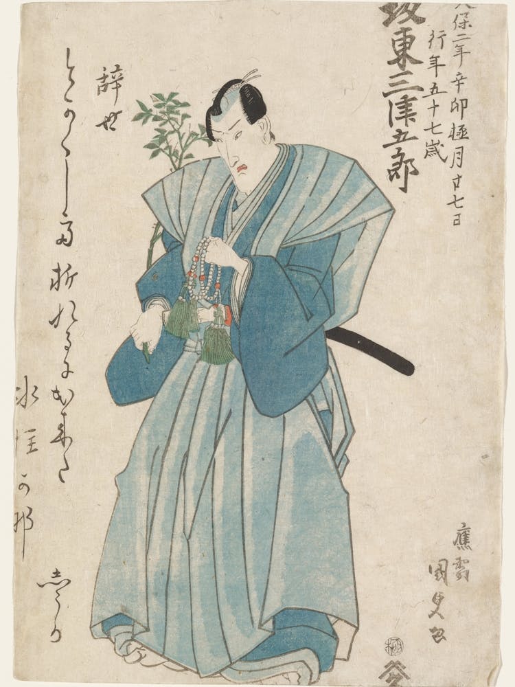 Standing Frowning Man, Looking Slightly Downward, Holding A Strand Of White And Coral Colored Beads With Large Green