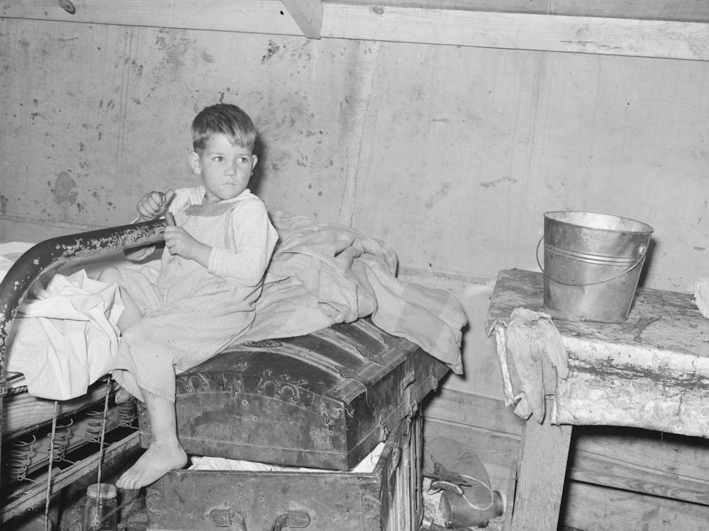 Son Of White Migrants Sitting On Trunk In Tent Home, Weslaco, Texas, See Caption 32108 D By Russell Lee