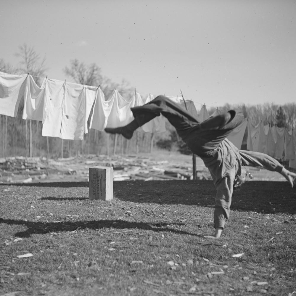 Lumberjack Turning Handspring Near Littlefork, Minnesota By Russell Lee