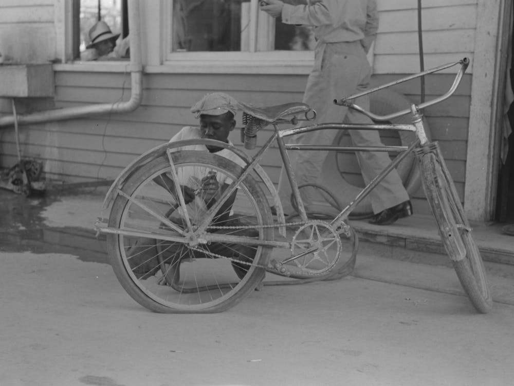 Inflating Bicycle Tire, Abbeville, Louisiana By Russell Lee
