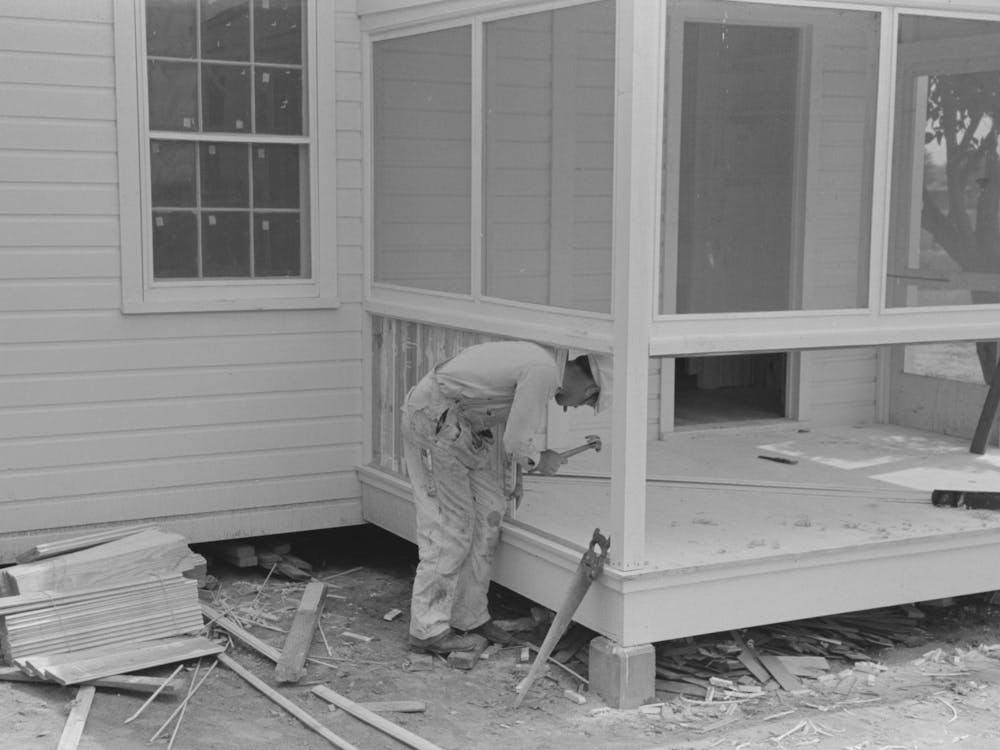 Southeast Missouri Farms Project, House Erection, Placing Bulkhead On Rear Screen Porches By Russell Lee