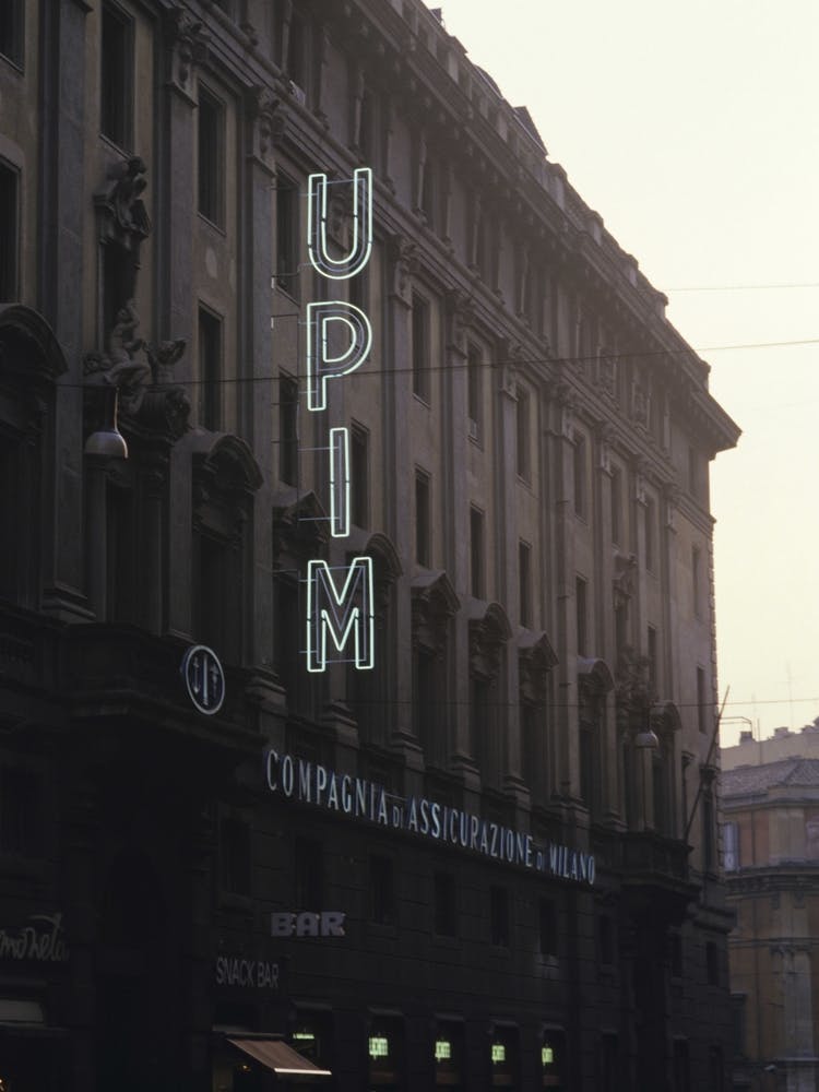 Upim Sign At Dusk Rome Italy