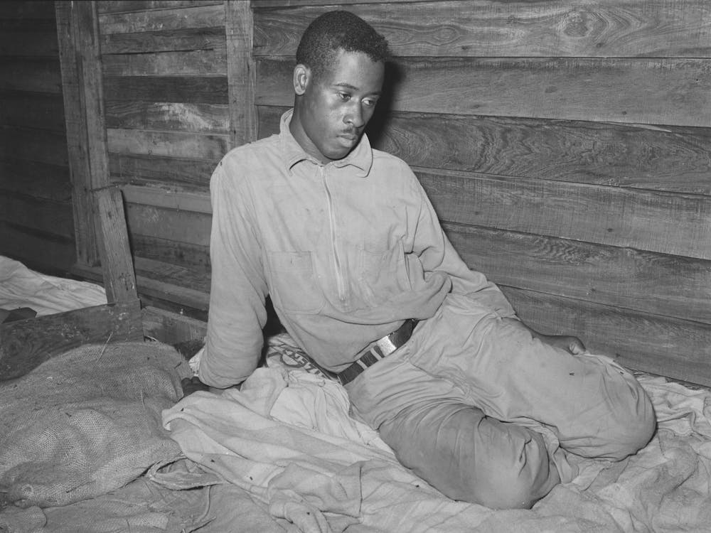 Strawberry Worker Sitting On His Bunk In Bunkhouse, Hammond, Louisiana By Russell Lee
