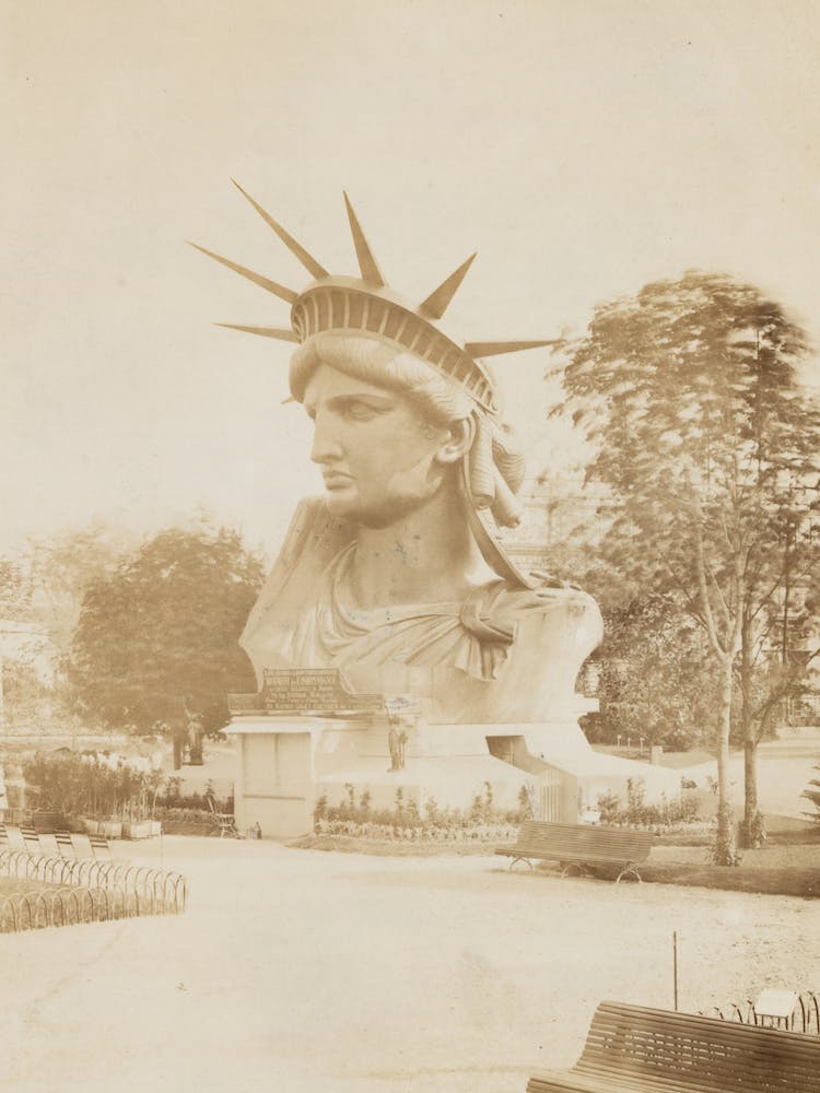 Head Of The Statue Of Liberty On Display In A Park In Paris, 1883