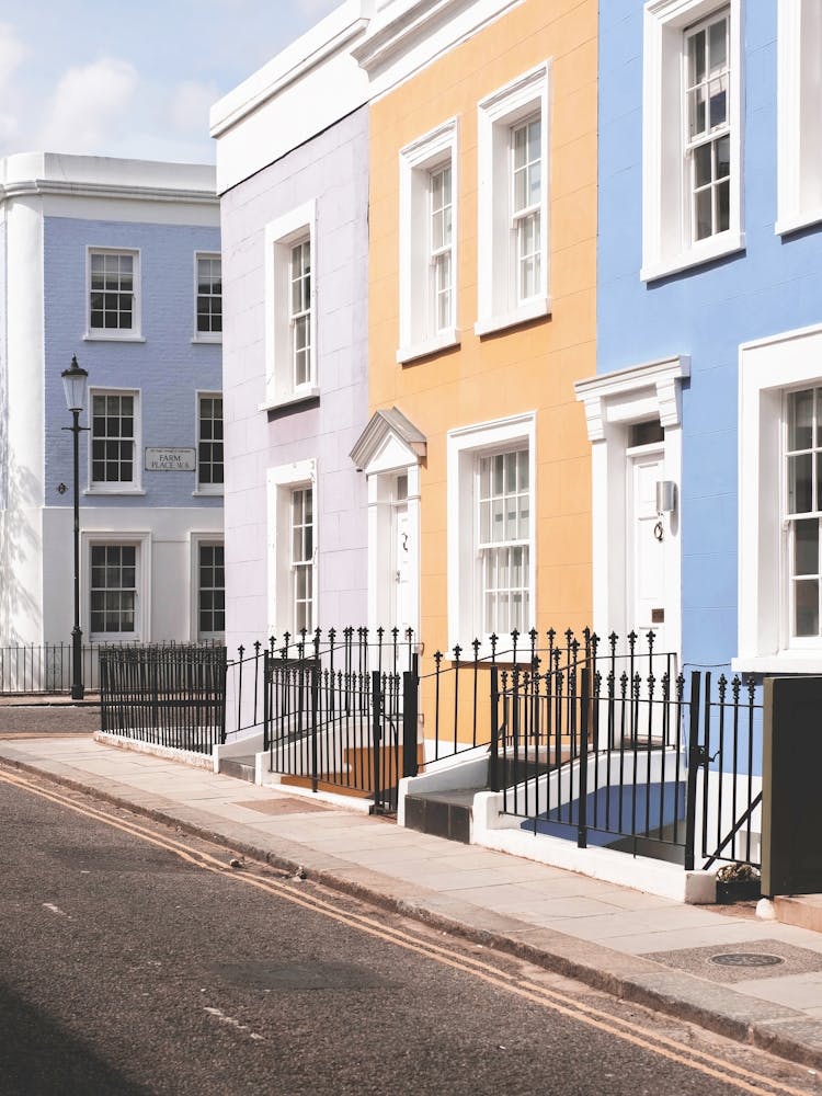 London, England I Street in Notting Hill with colorful houses and pastel tones Londoner architecture photography and English facades emblematic of minimalist geometric urban Europe city photography landscape