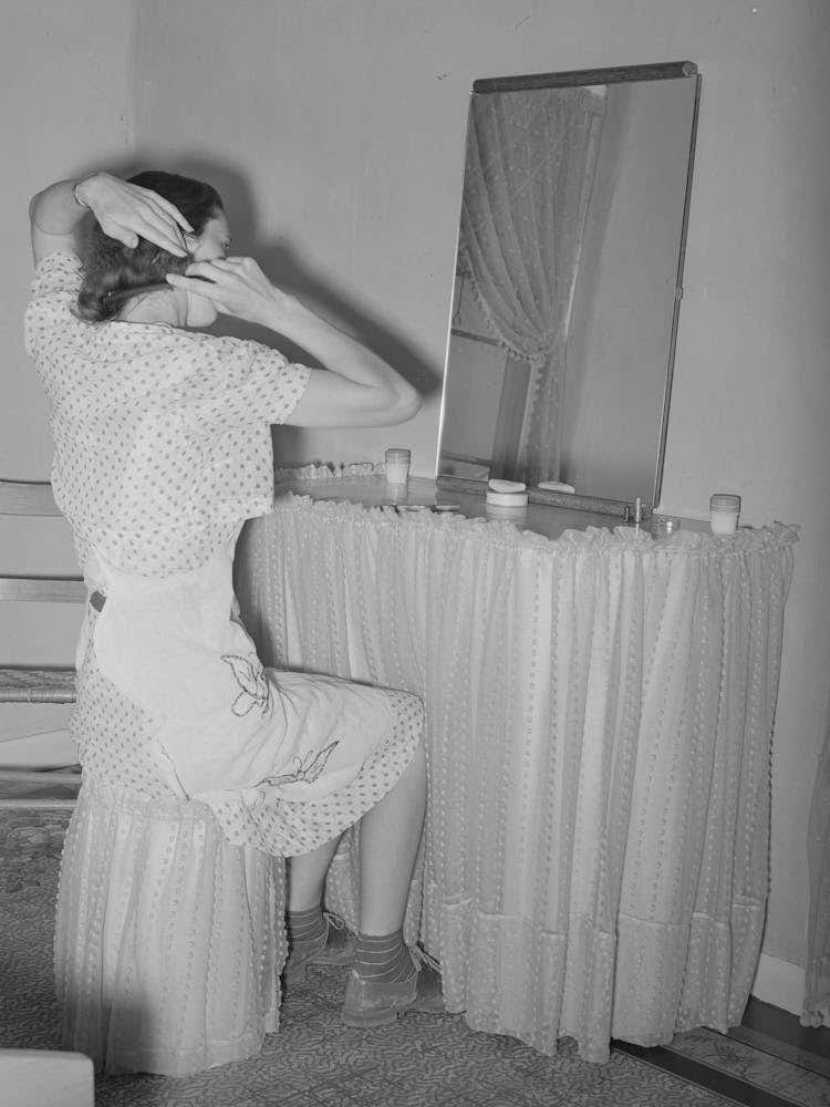 Wife Of Member Of The Casa Grande Valley Farms Sitting In Front Of Dressing Table In Her Home, Pinal County, Arizo