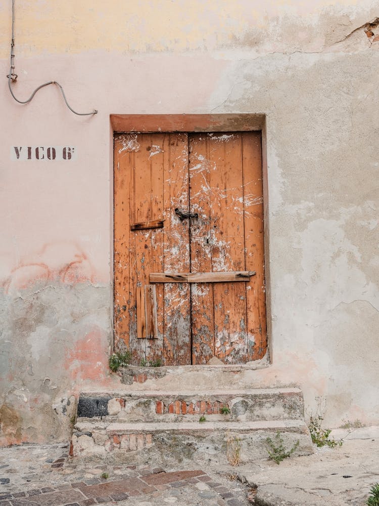 Old Wooden Door At Vico 6 In Italy