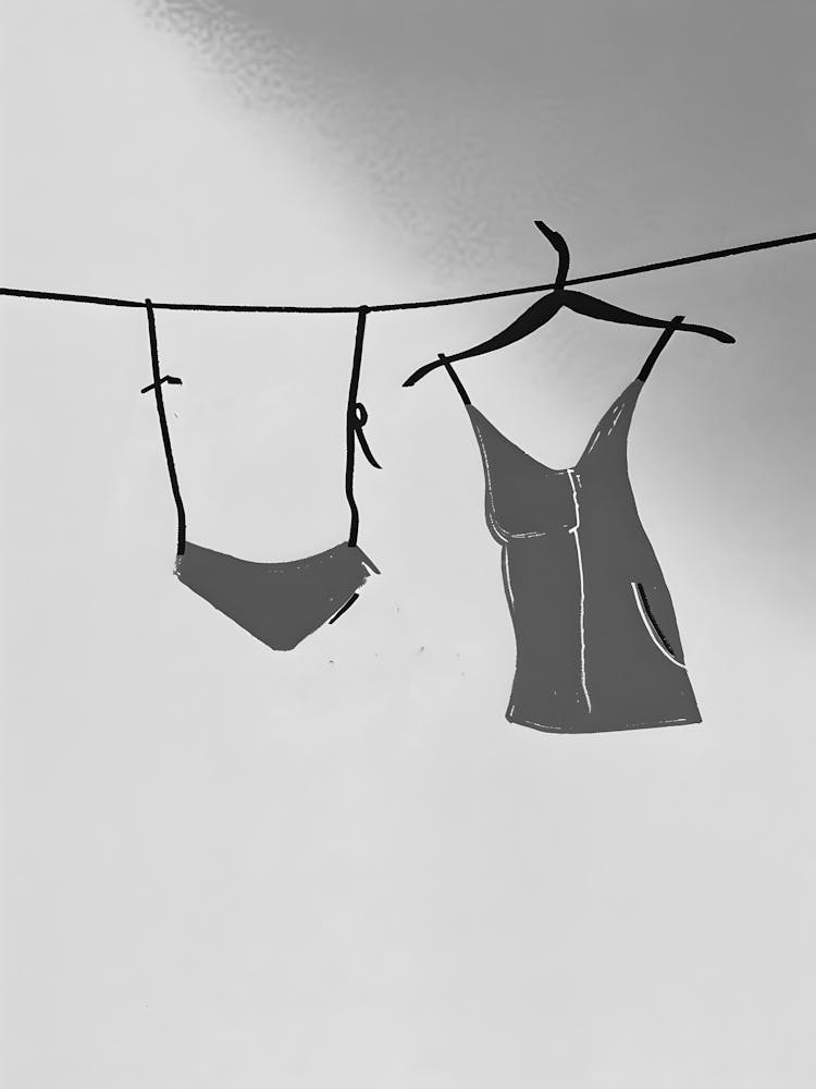 Two Clothes Hanging On A Line