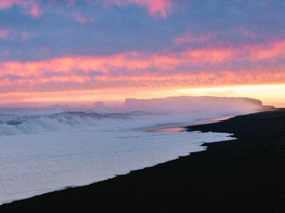 Sunset At Black Sand Beach Iceland