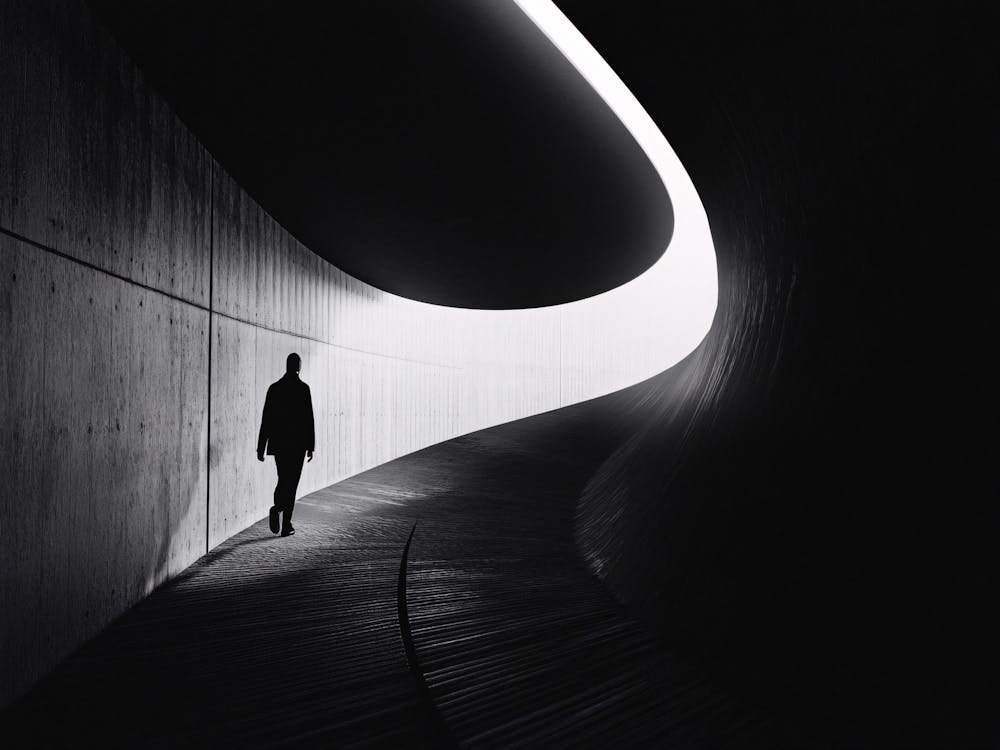 Person Walking In A Tunnel