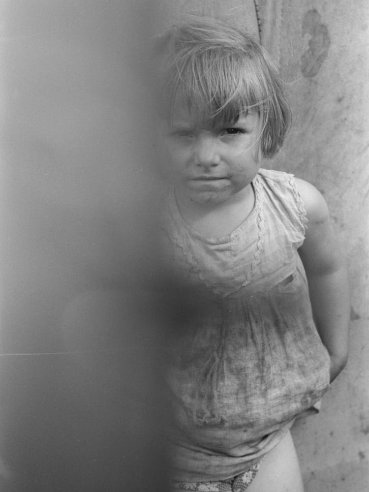 Untitled Photo, Possibly Related To Child Of Migrant Worker Standing By Tent Home Near Harlingen, Texas By Russel