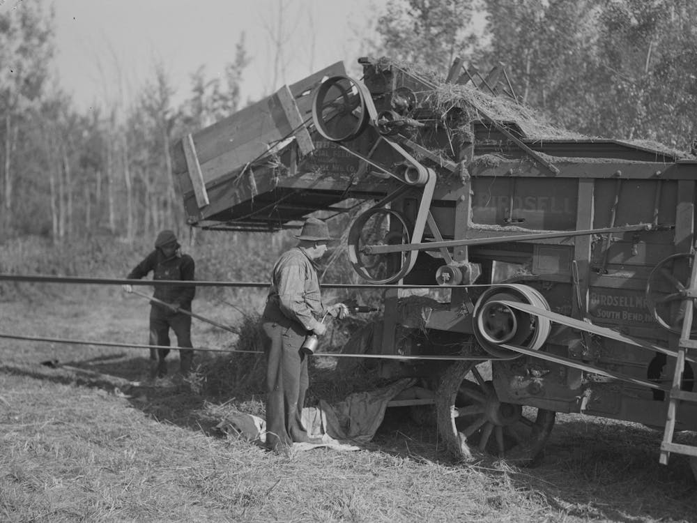 Oiling And Greasing Threshing Machine Near Littlefork, Minnesota By Russell Lee